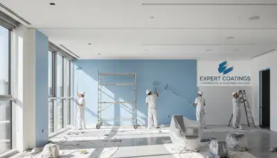 Commercial painting crew in St Petersburg, FL applying durable exterior coatings to a business building
