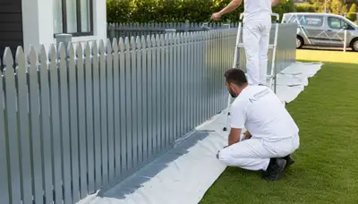 Fence painted in St Petersburg, FL by St Petersburg Paint Pros for durable coastal protection